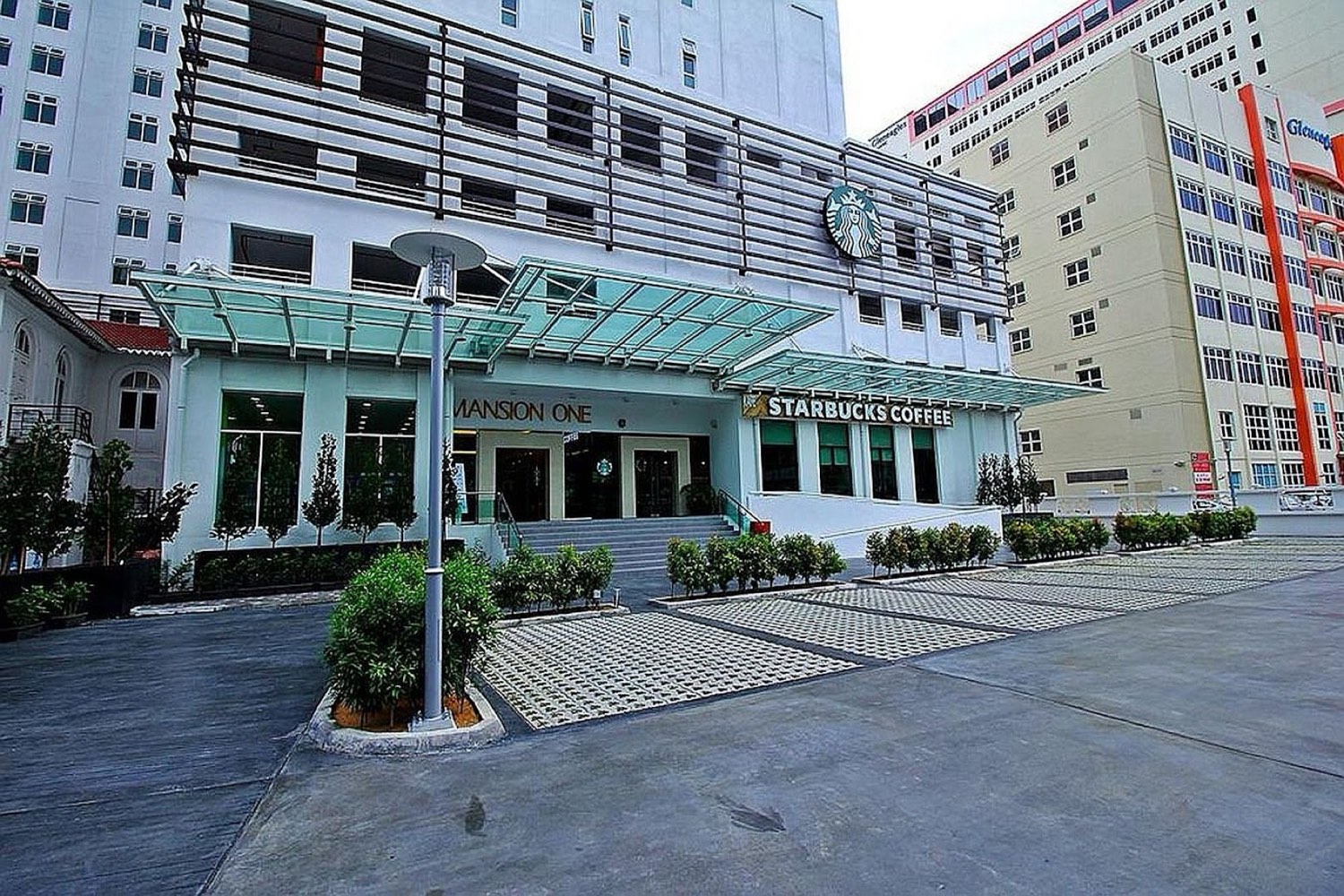The Mansion One building exterior on Jalan Sultan Ahmad Shah, with the ground-floor Starbucks